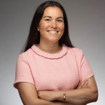 Andrea Conte of the New York Junior League smiles at the camera in a professional headshot.