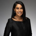 Archit Sarpangala Hegde of the New York Junior League smiles at the camera in a professional headshot.