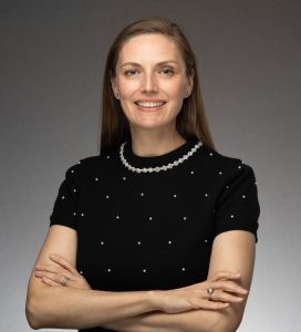 New York Junior League President Elizabeth Pavone smiles at the camera in a professional headshot.