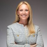 Gillian Boehringer of the New York Junior League smiles at the camera in a professional headshot.