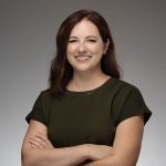 Katie Rowe of the New York Junior League smiles at the camera in a professional headshot.