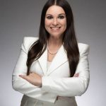 Katrine Pertsovski-Baldino of the New York Junior League smiles at the camera in a professional headshot.