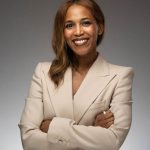 Lauren Austin of the New York Junior League smiles at the camera in a professional headshot.